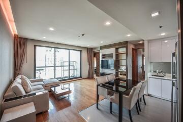 Modern living room with dining area and kitchen