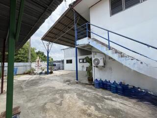 Outdoor area with staircase and water tanks