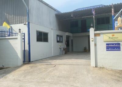 Entrance to a building with white walls and blue accents