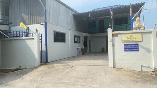 Entrance to a building with white walls and blue accents