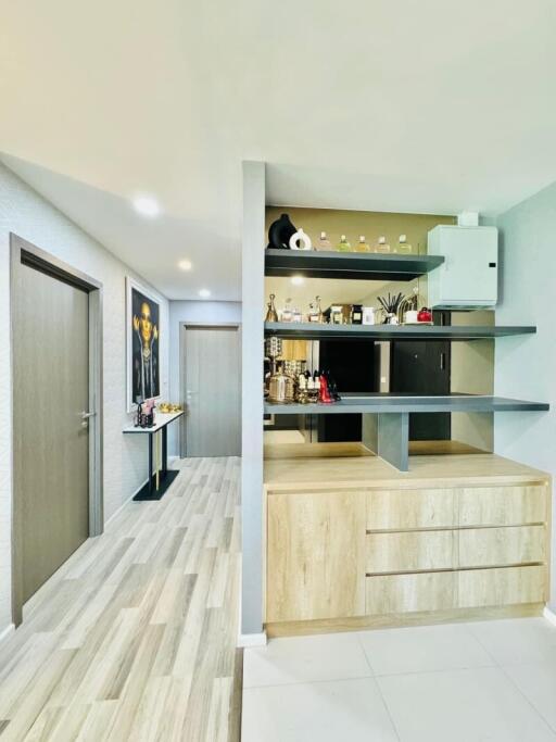 Modern hallway with built-in shelving and storage drawers