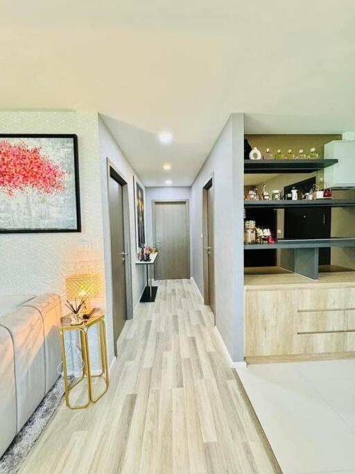 Modern hallway with wooden flooring and decorative elements