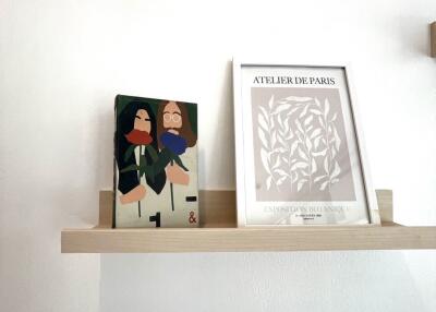 Shelf with books and artwork