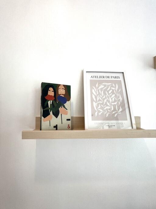 Shelf with books and artwork