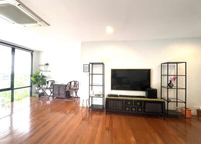 spacious living room with modern furniture and entertainment center