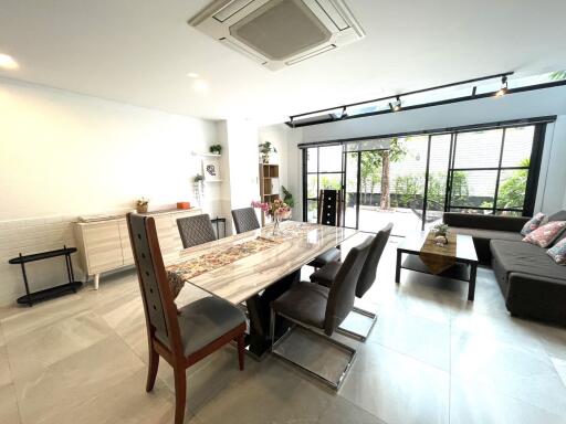 Spacious living and dining area with modern furniture