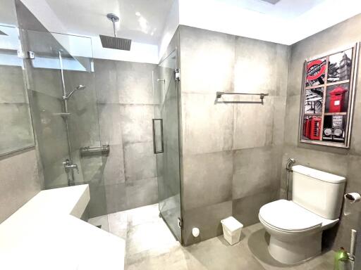 Modern bathroom with glass shower and toilet