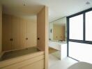 Modern bathroom with wooden cabinets and large mirror