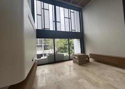 Spacious living room with large windows and natural light