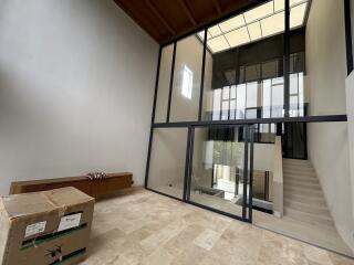 Modern building interior with large glass windows and staircase