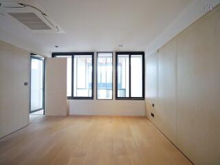 Modern minimalist living room with large windows