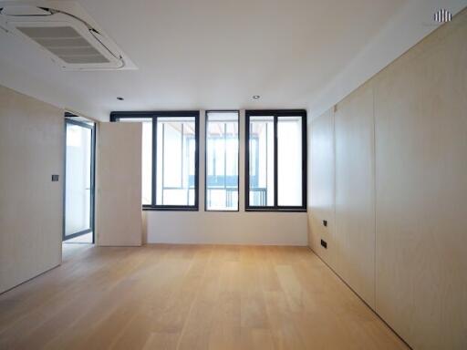 Modern minimalist living room with large windows