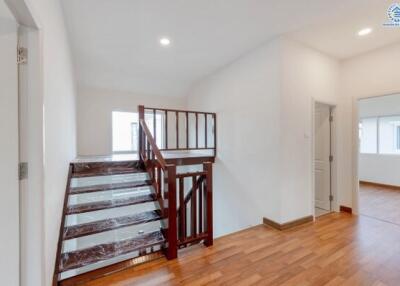 Staircase area with wooden steps and handrails