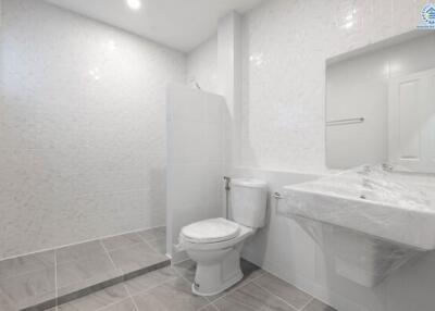 Modern white bathroom with large mirror and walk-in shower