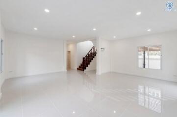 Spacious living room with staircase