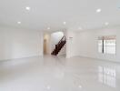 Spacious living room with staircase