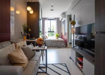 Modern living room with a view of the bedroom