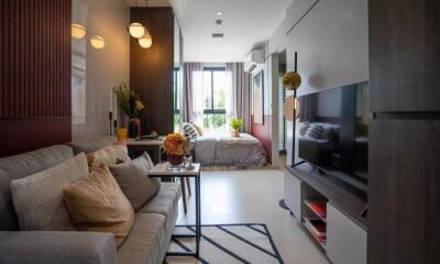 Modern living room with a view of the bedroom