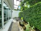 Outdoor garden with seating area and water fountain