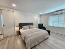 Spacious modern bedroom with a large bed and stylish furnishings