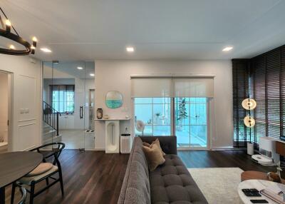 Modern living room with large windows and contemporary decor