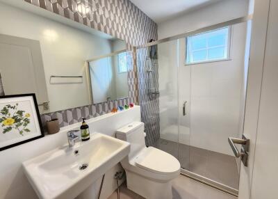 Modern bathroom with stylish tile work and a glass-enclosed shower