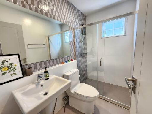 Modern bathroom with stylish tile work and a glass-enclosed shower