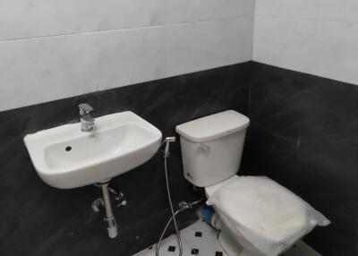 Bathroom with sink and toilet