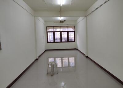 empty living area with a stool