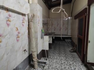 kitchen interior with tiled walls and flooring