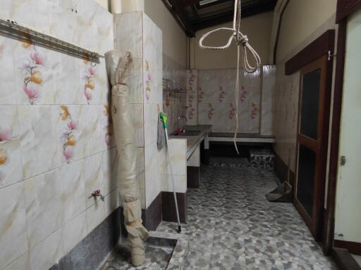 kitchen interior with tiled walls and flooring