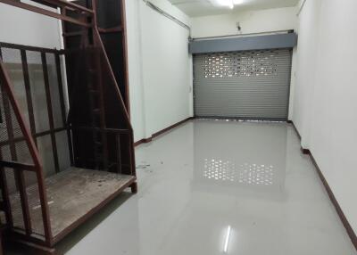 Empty storage room with metal stairs