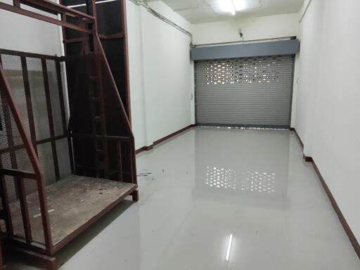 Empty storage room with metal stairs