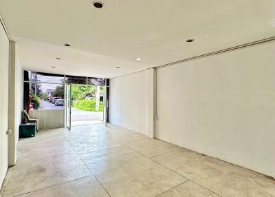 Empty main living space with large windows