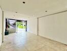 Empty main living space with large windows