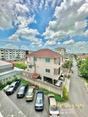 Aerial view of a residential building and surrounding area