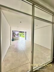 Spacious empty room with large glass doors