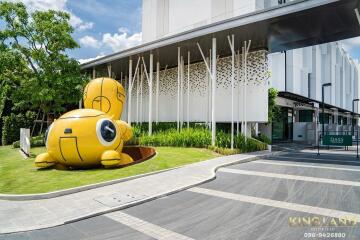 Modern building facade with unique yellow sculpture