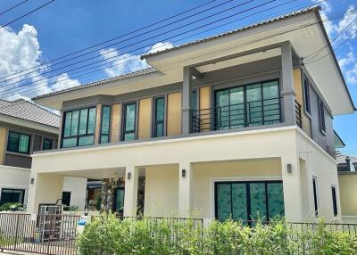 Exterior view of a two-story house on a sunny day