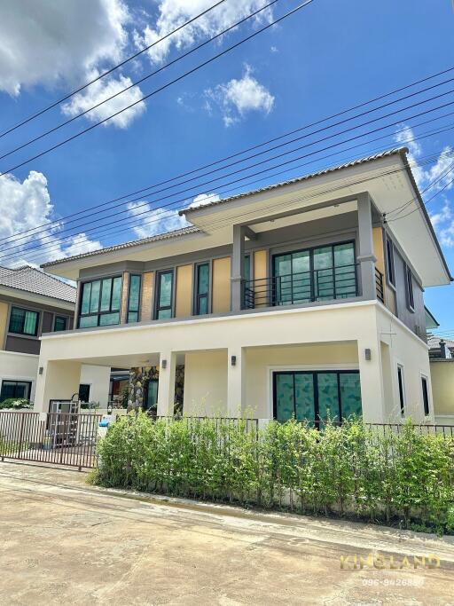 Exterior view of a two-story house on a sunny day