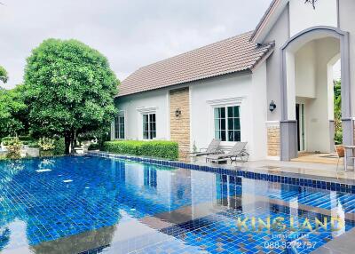 Outdoor area with swimming pool and house