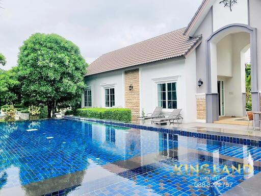 Outdoor area with swimming pool and house