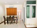 Modern dining area with table and chairs