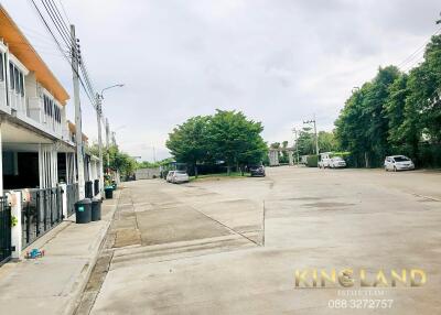 Residential street view with houses and greenery