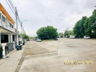 Residential street view with houses and greenery