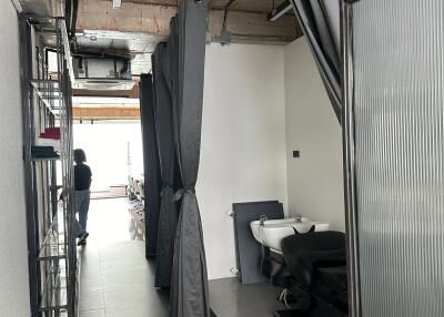 Industrial-styled interior space with barber or salon setup