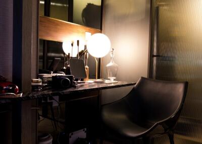 Modern home office with chair, desk, and lamp