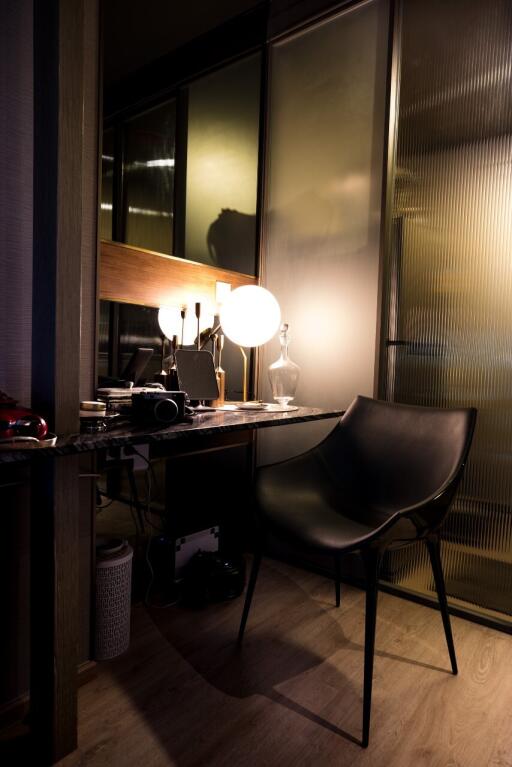 Modern home office with chair, desk, and lamp