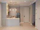 Modern kitchen with white cabinetry and stainless steel appliances