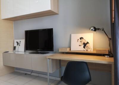 Modern living area with TV and workspace